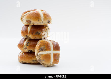 A stack of Easter holiday hot cross buns on an isolated white background. Stock Photo