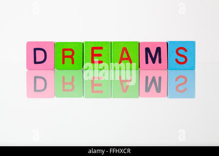 Dreams - an inscription from children's wooden blocks Stock Photo