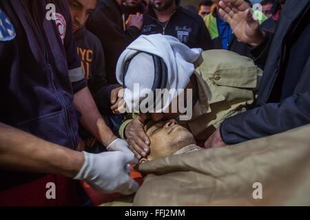 Bethlehem. 14th Feb, 2016. A relative of 17-year-old Palestinian Naeem Safi mourn over his body inside a hospital morgue in the West Bank city of Bethlehem on Feb. 14, 2016. Safi was shot dead as he attempted to stab a soldier at an Israeli military checkpoint, Israeli sources said. © Luay Sababa/Xinhua/Alamy Live News Stock Photo