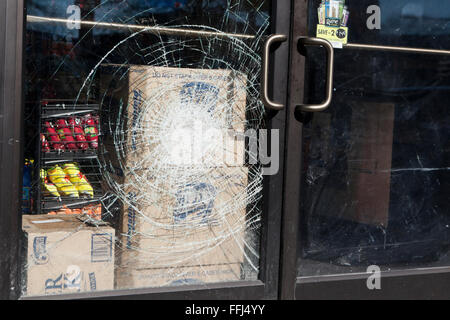 Broken safety glass store entrance door - USA Stock Photo