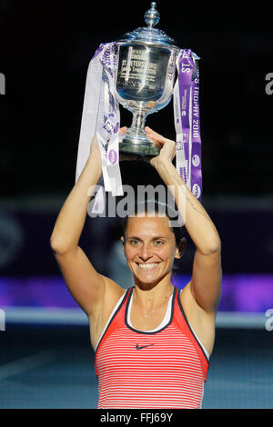 St. Petersburg, Russia. 14th February, 2016. Roberta Vinci of Italy holds the trophy over her head after winning her WTA St. Petersburg Ladies Trophy final match against Belinda Bencic of Switzerland. Credit:  Mikhail Kireev/Alamy Live News Stock Photo
