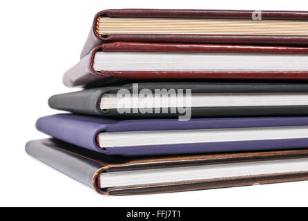 Pile of books in leather covers isolated on white background with clipping path Stock Photo