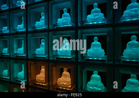 The Ruriden memorial hall at the Koukoko-ji temple on February 11, 2016 in Tokyo, Japan. In a country with an ageing population and a premium on space it is a modern collective tomb. Inside the hexagonal mausoleum there are over 2000 glass Buddhas lit by LED lights. Behind the Buddhas are compartments to store the ashes of the deceased. The light display changes color and pattern according to the season and time, and using a card reader system visitors can touch their card and display will change to indicate the Buddha representing their deceased. © Martin Hladik/AFLO/Alamy Live News Stock Photo