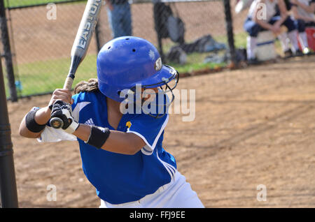 Batter in a high school girl's  softball game Stock Photo