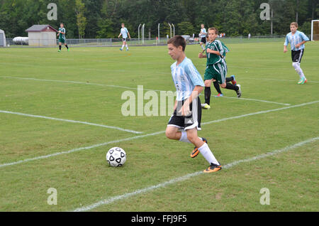 teen boy playing soccer Stock Photo