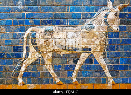 Ancient mosaic on the Ishtar Gate wall with mythical bull, Istanbul museum. Babylonian mosaic, fragment of the Ishtar Gate Stock Photo