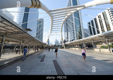 A modern pedestrian bridge crossing Sathorn Rd. near Chong Nonsi BTS station in Bangkok. Stock Photo