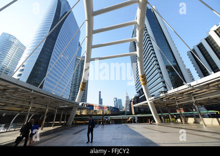 A modern pedestrian bridge crossing Sathorn Rd. near Chong Nonsi BTS station in Bangkok. Stock Photo