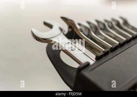 DIY Set of chrome metal home spanners. The wrenches are of various sizes with large copy space area for construction or repair c Stock Photo