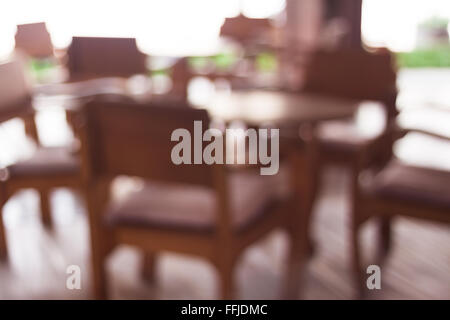 Coffee shop blur background with wooden table, stock photo Stock Photo