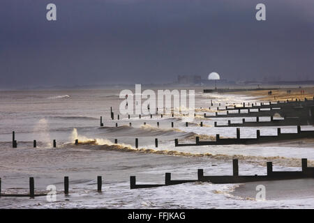 Sizewell Nuclear Power station, groynes photographed from Southwold, with considerable wave action and spray, in stormy light, Stock Photo