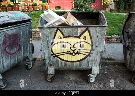 graffiti of cat on large dustbin at Crnogorska Street in Savamala district, Belgrade, Serbia Stock Photo