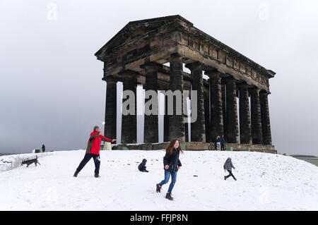Sunderland, UK. 15th February, 2016. UK Weather: Snow has fallen over north east England, enabling a family to enjoy a snowball fight on top of Penshaw Hill, in front of local landmark, Penshaw Monument Credit:  Washington Imaging/Alamy Live News Stock Photo