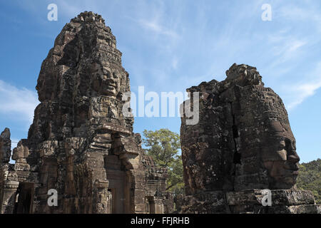 Huge stone faces on the towers of Bayon temple, Angkor Thom, near Siem Reap, Cambodia, Asia. Built in late 12th or early 13th ce Stock Photo