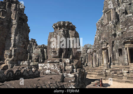 Huge stone faces on the towers of Bayon temple, Angkor Thom, near Siem Reap, Cambodia, Asia. Built in late 12th or early 13th ce Stock Photo