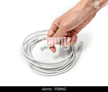 Ready-made LAN cable on IT professional hand Stock Photo