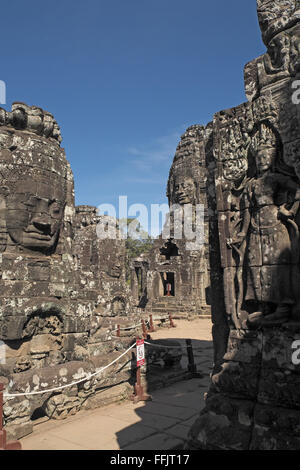 Huge stone faces on the towers of Bayon temple, Angkor Thom, near Siem Reap, Cambodia, Asia. Stock Photo