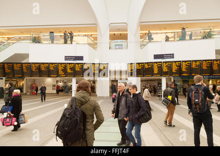 People on the concourse with the train departure board, New Street Station, Birmingham UK 2016 Stock Photo