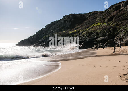 Porthcurno, Cornwall, UK. 15th February 2016. UK Weather. Bright sunshine on Porthcurno beach, sheltered from the northerly winds, for the start of half term week. Credit:  Simon Maycock/Alamy Live News Stock Photo