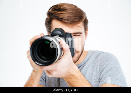 Young photographer making shot on photo camera Stock Photo