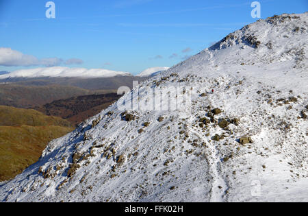 Two Walkers on Footpath Heading Towards Swirl Hawse from Wetherlam Stock Photo