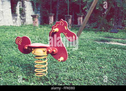 rocking horse in public park Stock Photo