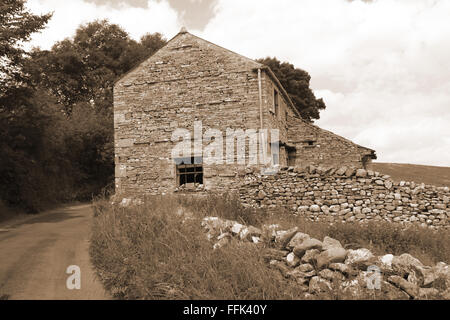 Black and white photograph of an old, stone farmhouse, Carlton, Yorkshire Dales, Englamd Stock Photo