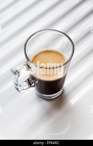 Black coffee in a clear glass mug on a white background Stock Photo