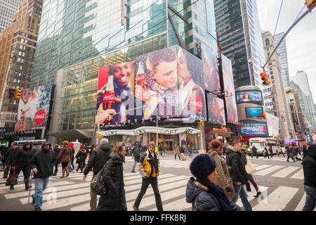 A winter themed Coca-Cola billboard dominates a Times Square intersection in New York on Tuesday, February 9, 2016. Fourth-quarter profits for Coca-Cola rose despite a drop in Diet Coke sales. Global volume rose as consumers reached for healthier alternatives to soda. (© Richard B. Levine) Stock Photo