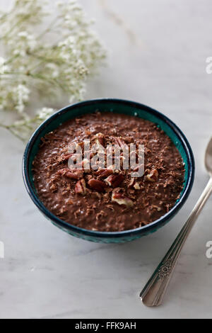 Chocolate chia pudding topped with pecans and dark chocolate Stock Photo