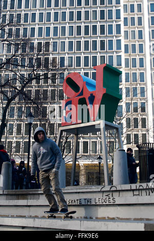 Philadelphia, USA. 14th February, 2016. A skater role past the iconic Robert Indiana LOVE statue during a Feb. 14. 2016 gathering of skaters in the weekend prior to the scheduled demolition of the Center City Philadelphia, PA. park.   Skaters came en masse to LOVE Park in the extended weekend of Feb. 13 to Feb. 15., 2016 for “one more spin” after a  city-imposed ban got lifted till demolition of the iconic park at JFK Plaza in Center City Philadelphia, PA starts after President’s Day. Credit:  Bastiaan Slabbers/Alamy Live News Stock Photo