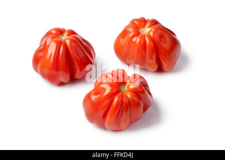 Fresh red Coeur de boeuff tomatoes on white background Stock Photo