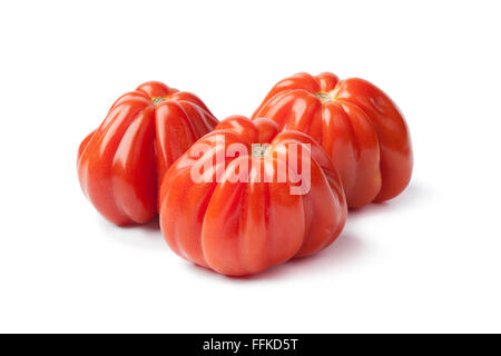 Fresh red Coeur de boeuff tomatoes on white background Stock Photo