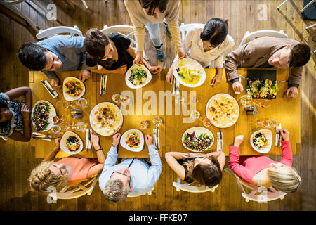 Group of friends on dinner party in restaurant Stock Photo