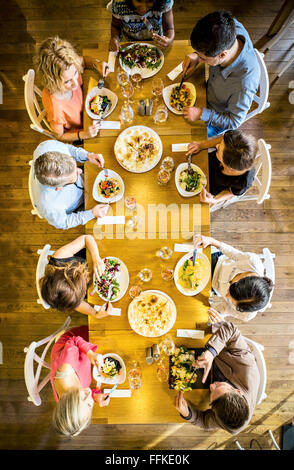 Group of friends on dinner party in restaurant Stock Photo