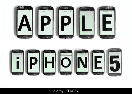 Apple iPhone 5 written on the screens of smartphones photographed against a white background. Stock Photo