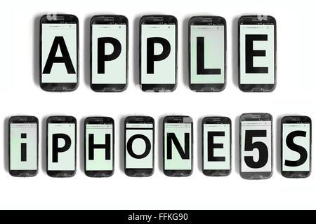 Apple iPhone 5s written on the screens of smartphones photographed against a white background. Stock Photo