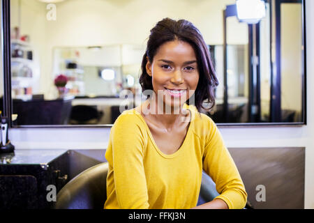 Portrait of female hairstylist in hair salon Stock Photo