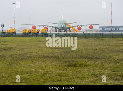 Hamburg, Germany. 12th Feb, 2016. An Airbus A380 aeroplane outside a factory in Hamburg, Germany, 12 February 2016. PHOTO: LUKAS SCHULZE/DPA/Alamy Live News Stock Photo