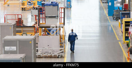 Hamburg, Germany. 12th Feb, 2016. An Airbus employee walks through a factory in Hamburg, Germany, 12 February 2016. PHOTO: LUKAS SCHULZE/DPA/Alamy Live News Stock Photo