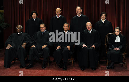 February 13, 2016 -(FIle Photo) - Supreme Court Justice Antonin Scalia has died at the age of 79. PICTURED: Oct. 8, 2010 - Washington, District of Columbia, United States of America - The Supreme Court Justices of the United States sit for a formal group photo in the East Conference Room of the Supreme Court in Washington on Friday, October 8, 2010. The Justices are (front row from left) Clarence Thomas, Antonin Scalia, John G. Roberts (Chief Justice), Anthony Kennedy, Ruth Bader Ginsburg; (back row from left) Sonia Sotomayor, Stephen Breyer, Sameul Alito and Elena Kagan, the newest member of Stock Photo