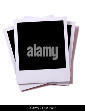 Untidy stack of three blank instant camera photo prints isolated on white with shadow.  Space for copy. Stock Photo