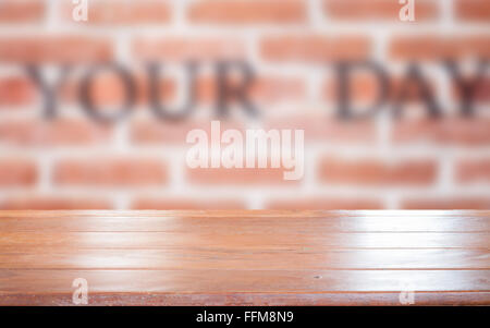Old empty wooden table top with brick wall background, stock photo Stock Photo