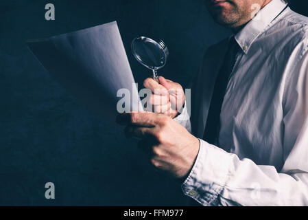 Tax inspector doing financial auditing, businessman reading business report or contract footnotes disclaimer