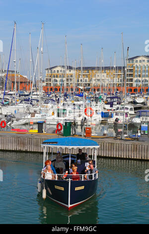 Pleasure boat sightseeing trip round Sovereign Harbour Marina, Eastbourne, Sussex, UK Stock Photo