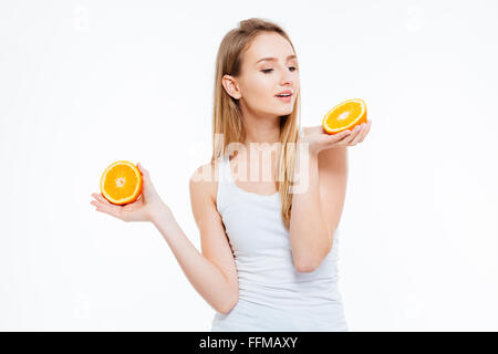 Beautiful young woman holding orange isolated on a white background Stock Photo