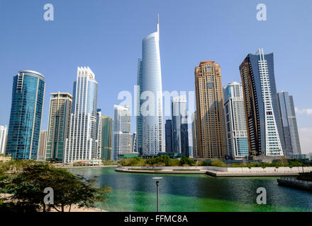 Daytime skyline view of Almas Tower and modern high-rise office and apartment buildings at  JLT, Jumeirah Lakes Towers in Dubai Stock Photo