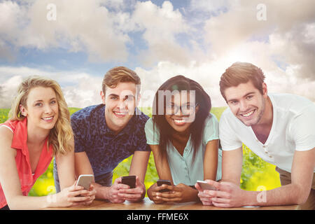 Composite image of creative team all using smartphones Stock Photo
