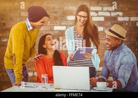 Composite image of young creative team having a meeting Stock Photo