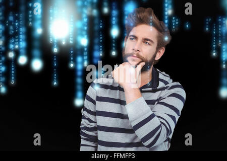 Composite image of thoughtful hipster with hand on chin Stock Photo